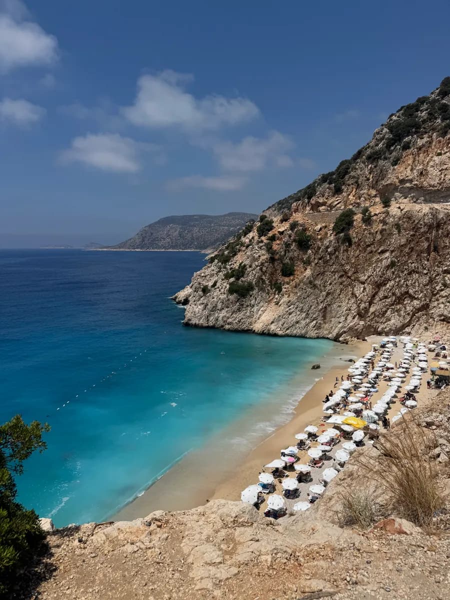 Turquoise water and limestone cliffs at Kaputaş Beach in Kaş, Turkey